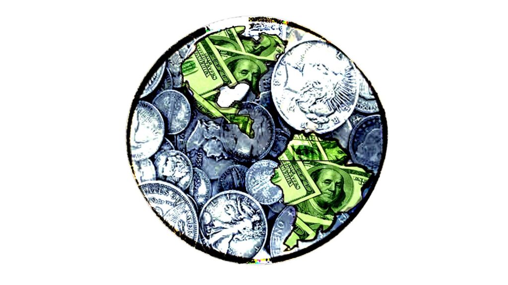 A photo showing a piece of the world map with monetary elements, coins and dollars